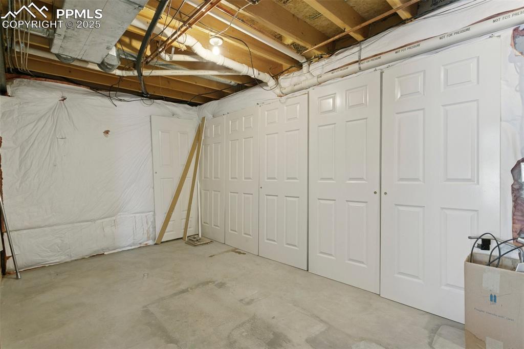 Image 47 of 50: Huge storage area/mechanical room combo! There is LOTS of closet space on t