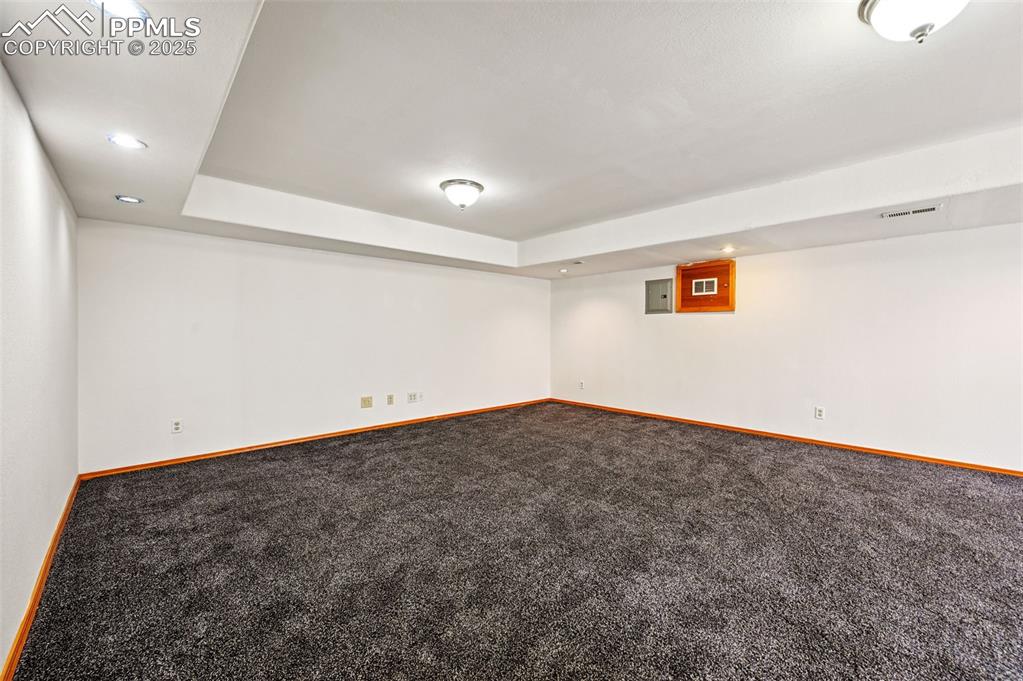 Image 32 of 50: Finished basement featuring carpet floors and recessed lighting