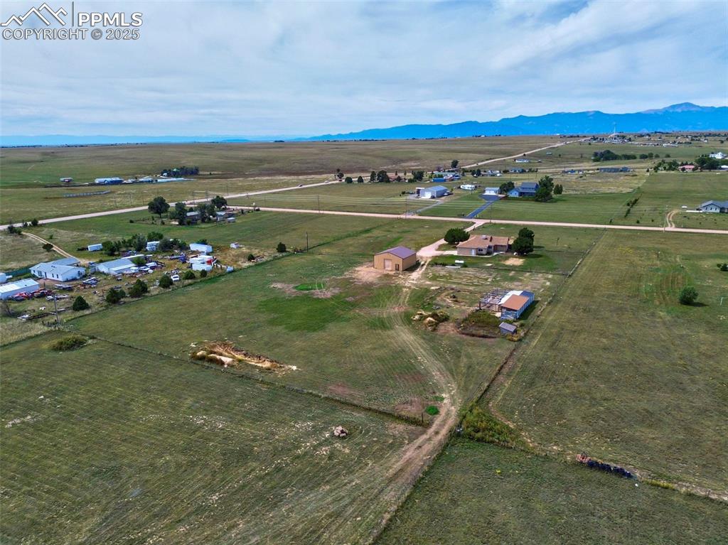 Image 48 of 50: View of property location with rural landscape and a mountain backdrop