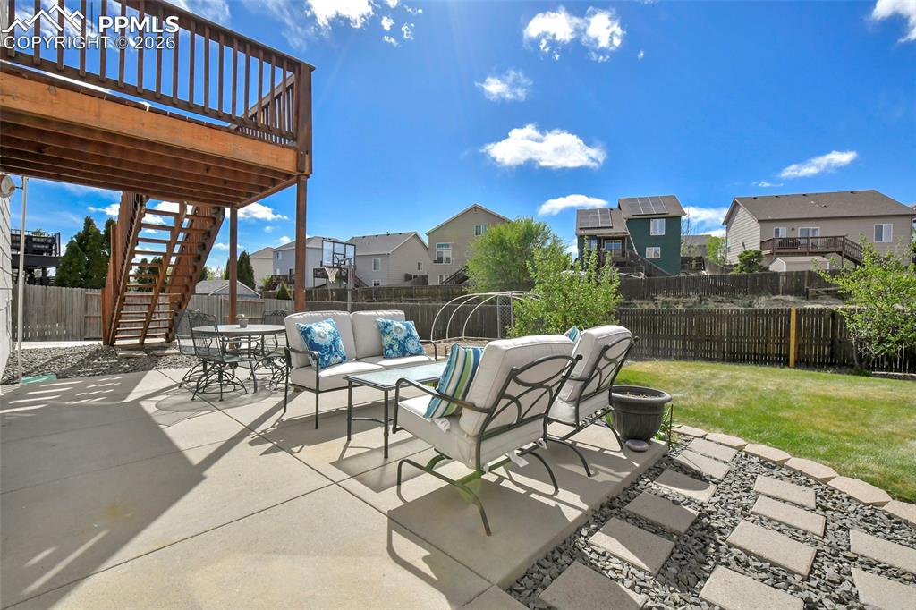 Image 30 of 46: Expansive concrete patio for entertaining