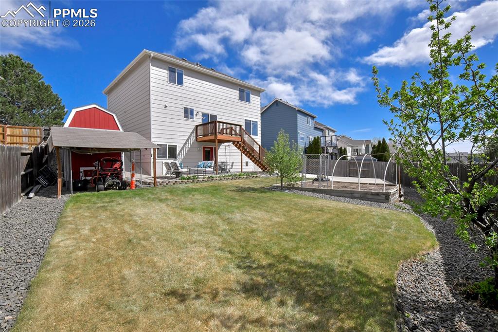 Image 39 of 46: Includes two-level shed with an attached covered structure for a chicken co