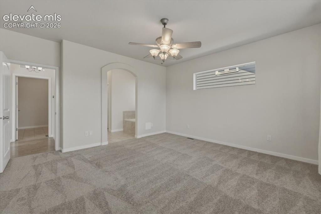 Image 20 of 50: Open-concept living area featuring wood-finish flooring throughout, a ceili
