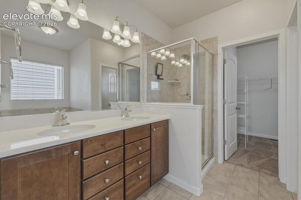 Image 23 of 50: Spacious carpeted room featuring a ceiling fan with integrated lighting, mu