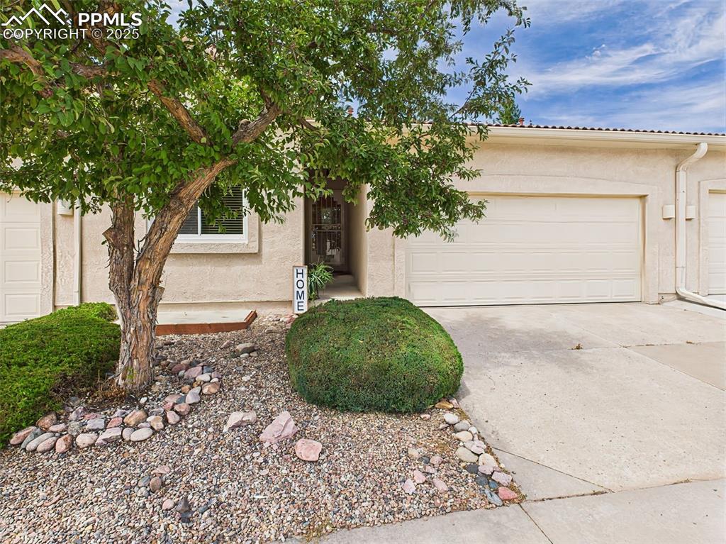 Caption: Welcome Home! Covered Entry and HOA maintained landscaping!