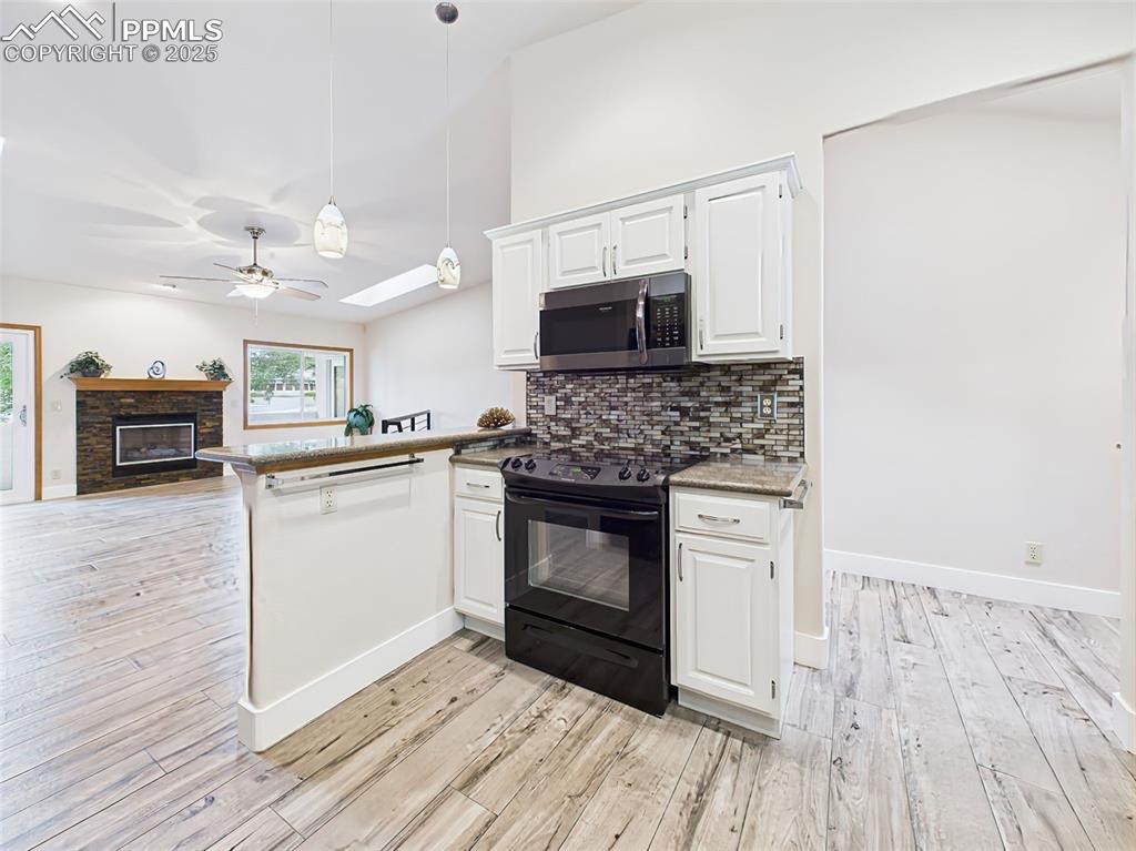 Image 14 of 50: Breakfast bar with new pendant lights!