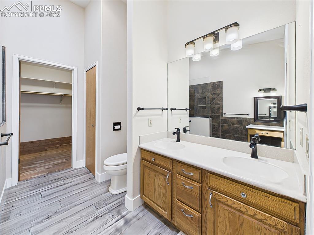 Image 27 of 50: Updated and modern with newer flooring, double vanity, lights and a cedar-l