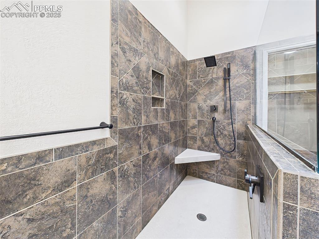 Image 29 of 50: Once you step into this custom shower you might not want to come out!
