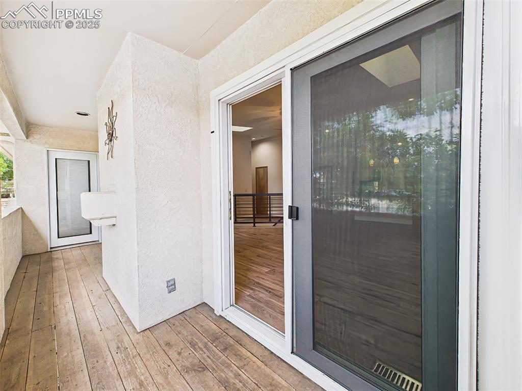 Image 8 of 50: Private balcony access from main-level great room and primary suite!