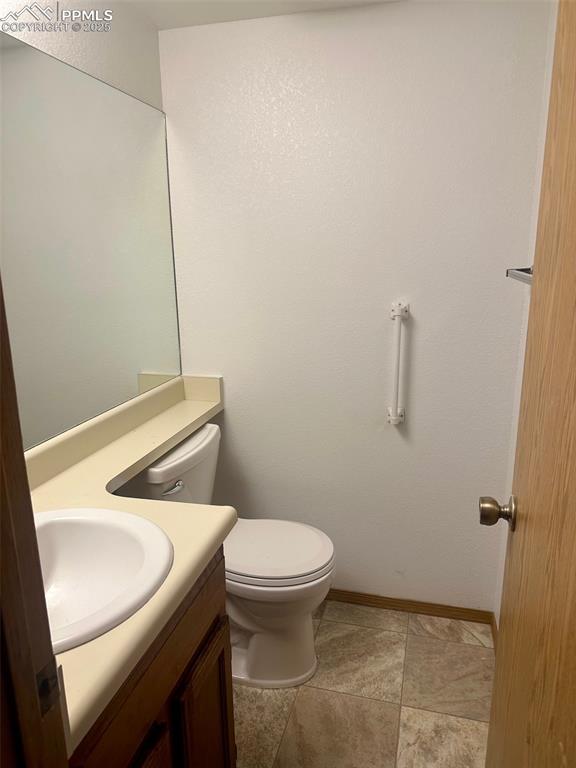 Image 14 of 39: Main level half bath.