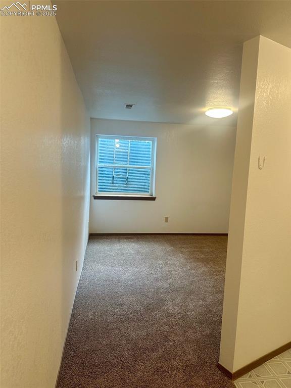 Image 26 of 39: 3rd bedroom in basement level.