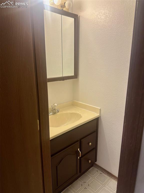 Image 30 of 39: Basement level bath.