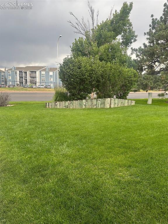 Image 6 of 39: Common area green space in front of home.