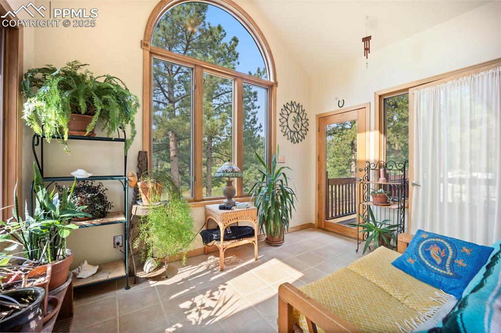 Image 11 of 50: Sun Room leads to 24