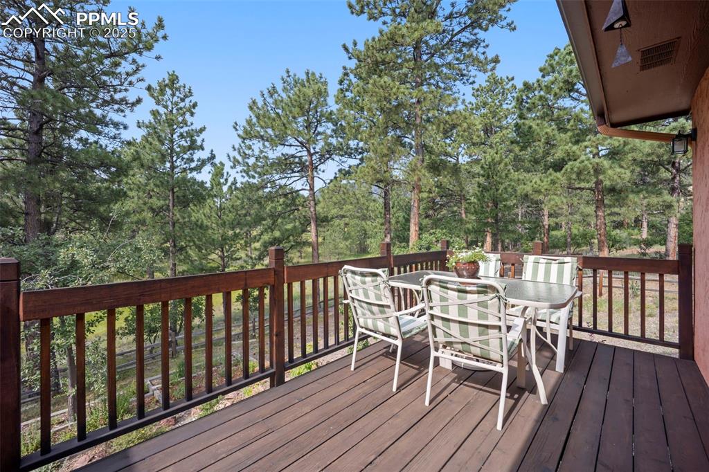 Image 12 of 50: Outdoor Dining is enhanced by this peaceful setting