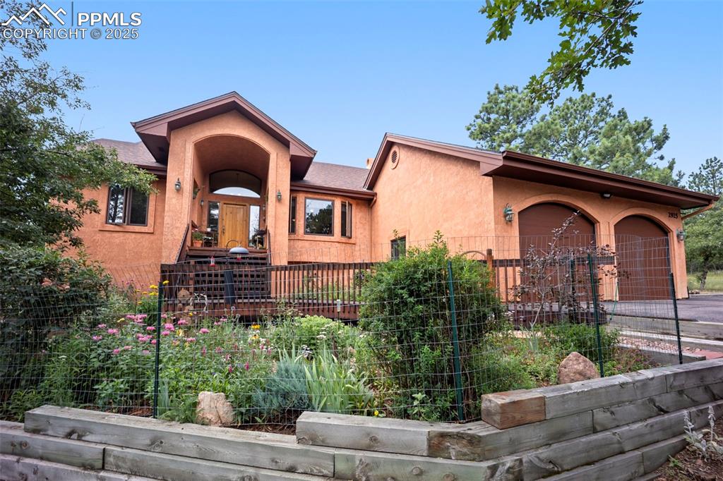 Image 2 of 50: Beautiful perennial gardens enhance this home