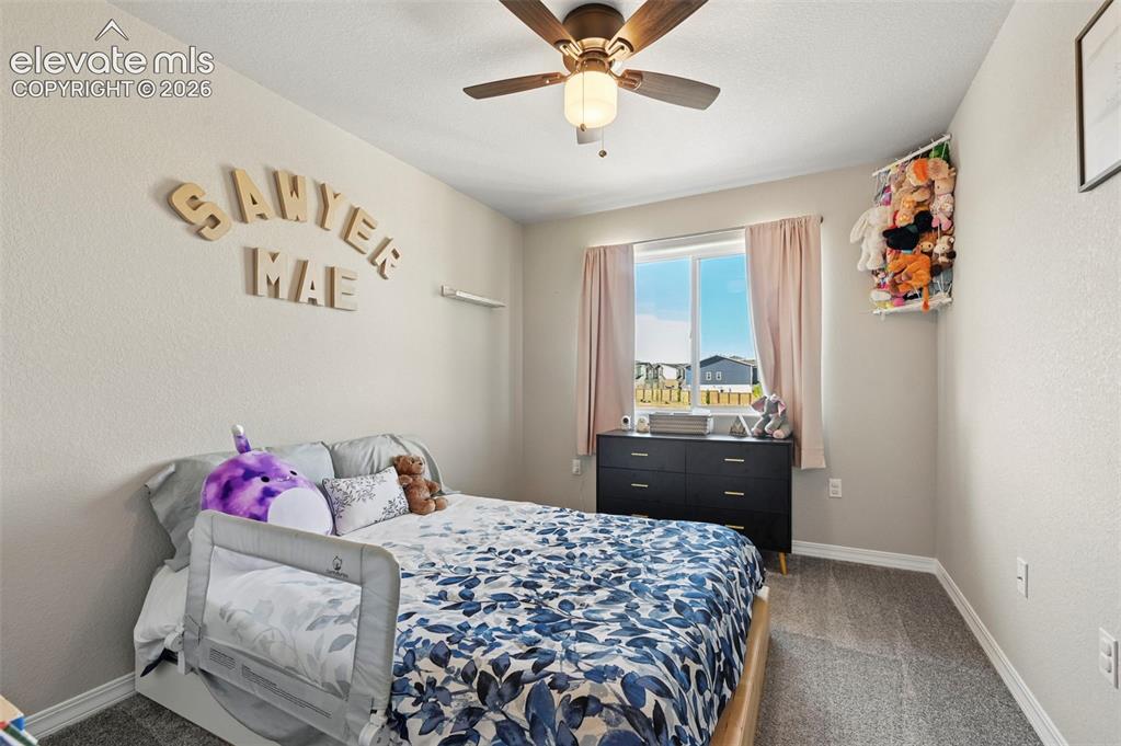 Image 12 of 30: Room featuring a window with natural light, a ceiling fan with integrated l