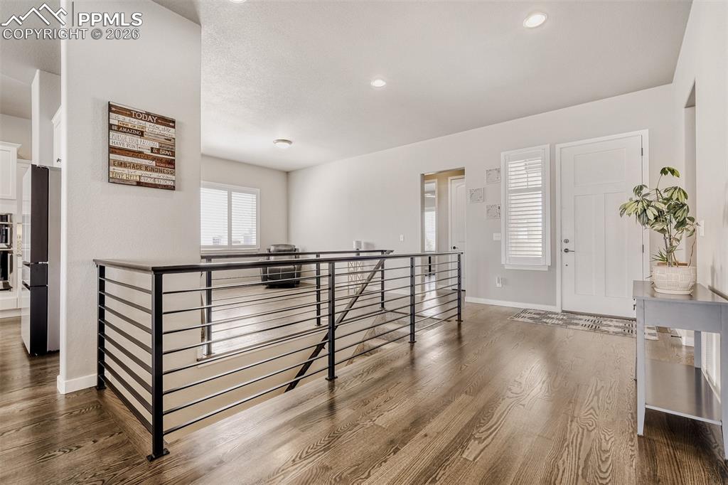 Image 8 of 44: Virtually staged formal dining of foyer. Also potential sitting, library or