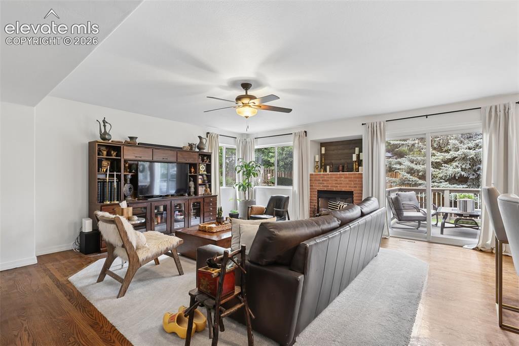 Image 13 of 27: family room with lots of light and walk out to rear deck and back yard