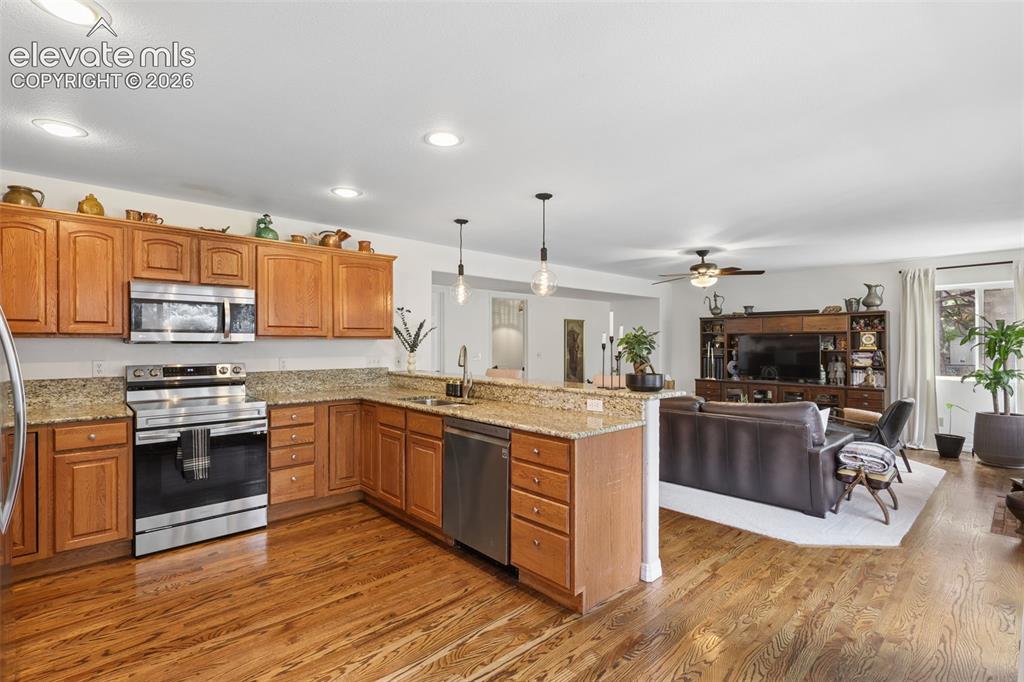 Image 4 of 27: Kitchen and adjacent family/great room