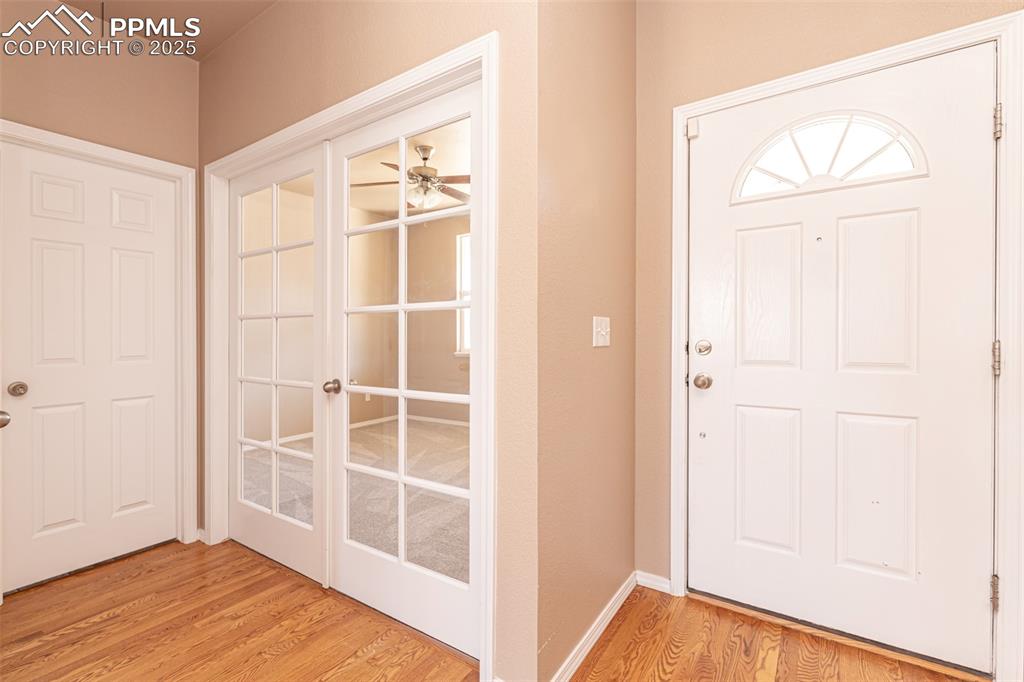 Image 11 of 41: Foyer featuring light wood finished floors, half bath, hall closet and fren