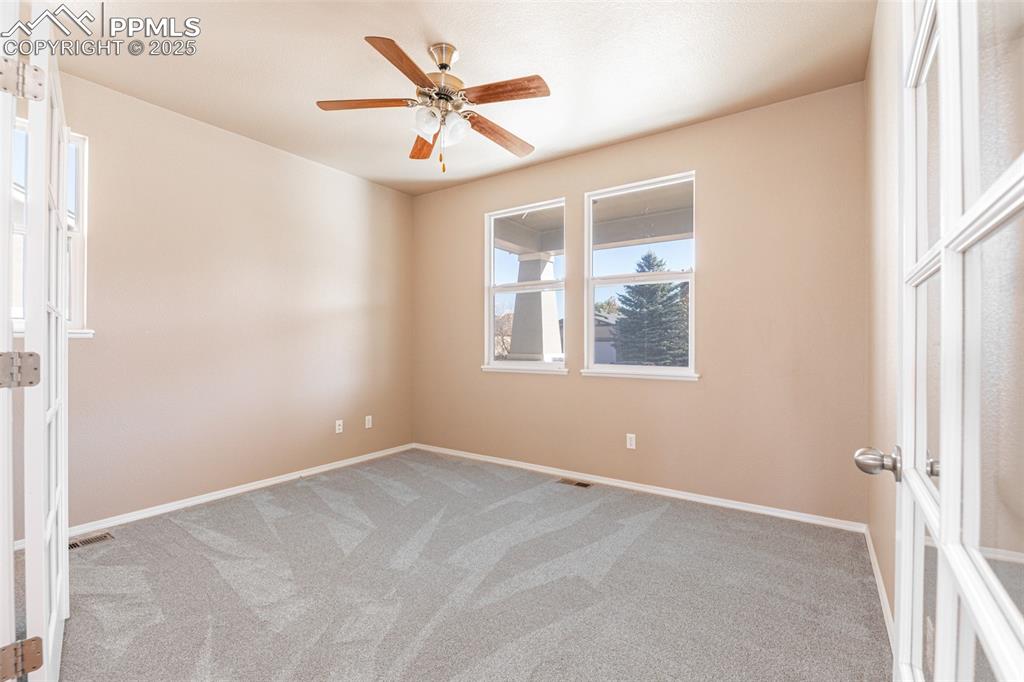 Image 12 of 41: New light colored carpet and ceiling fan.  Make this room anything you want