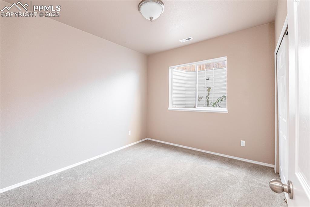 Image 26 of 41: Unfurnished bedroom featuring carpet and a closet