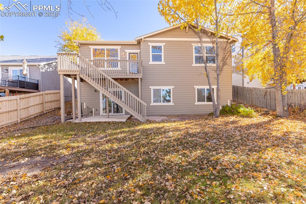 Image 35 of 41: Rear view of house featuring a patio area, a fenced backyard, a deck, and s