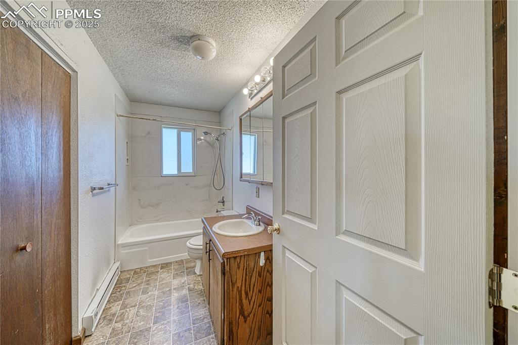 Image 19 of 46: Main house bathroom and laundry