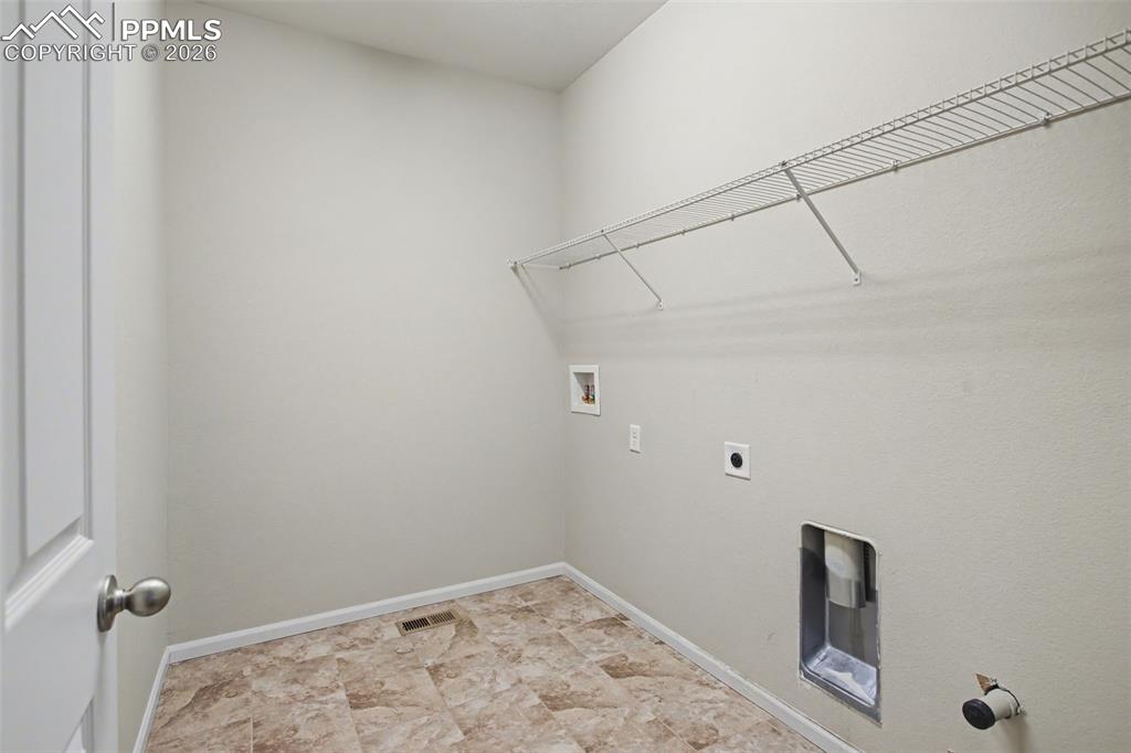 Image 19 of 40: Laundry area with washer hookup and hookup for an electric dryer