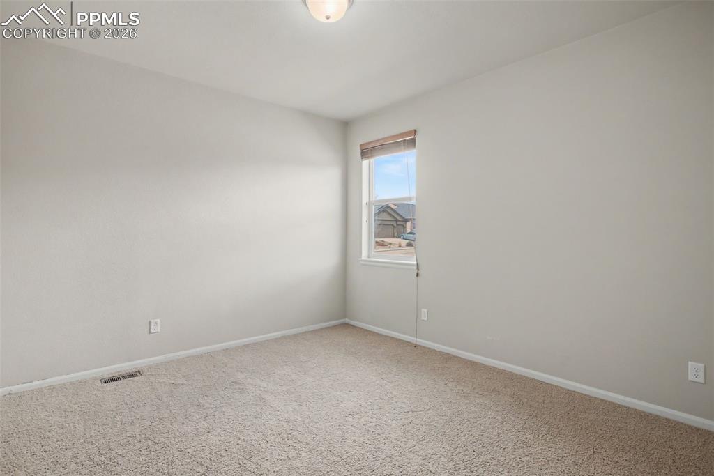 Image 27 of 40: Unfurnished room featuring carpet floors and baseboards
