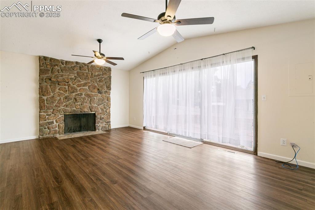 Image 13 of 43: This wonderful family room, adjacent to the kitchen, includes a WB fireplac