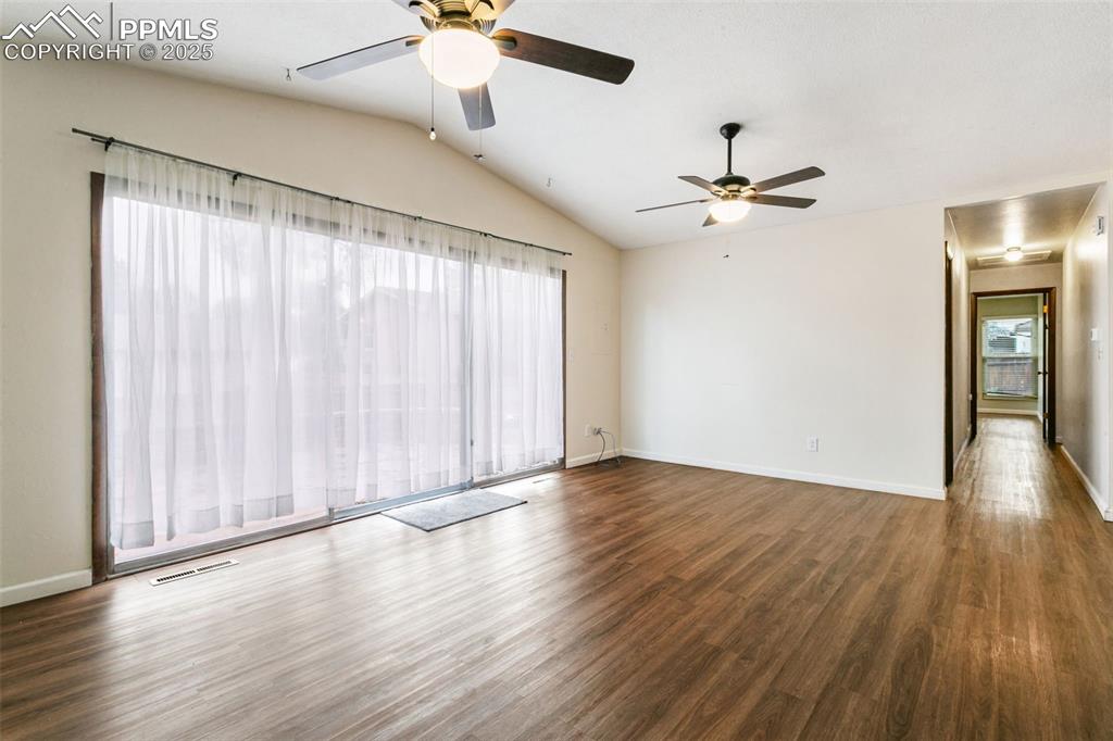 Image 16 of 43: The hallway off the family room leads to the bedrooms and bathroom.