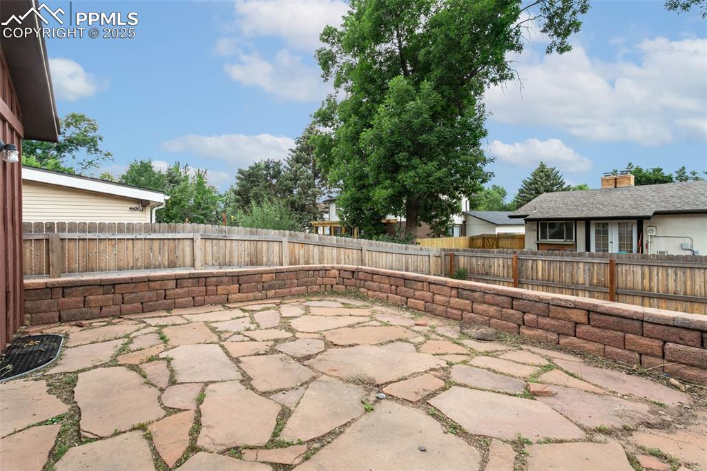 Image 17 of 43: This patio can be a great space to enjoy outdoor barbecues with family and 