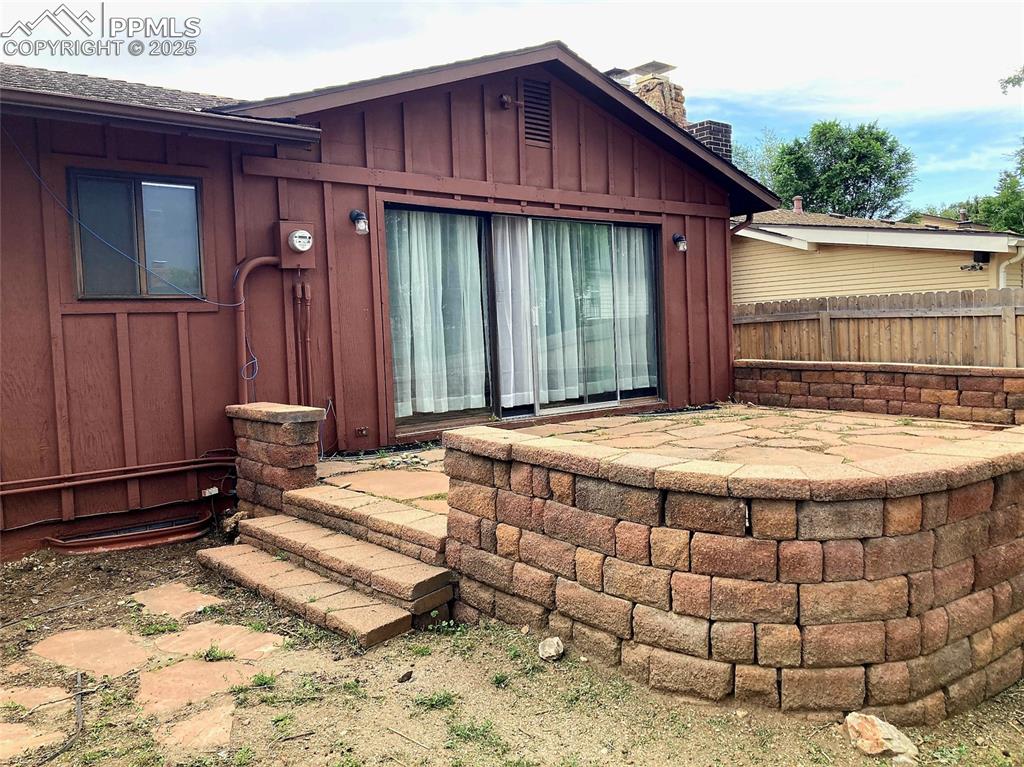 Image 18 of 43: Relax and entertain on the large flagstone patio which provides access to t