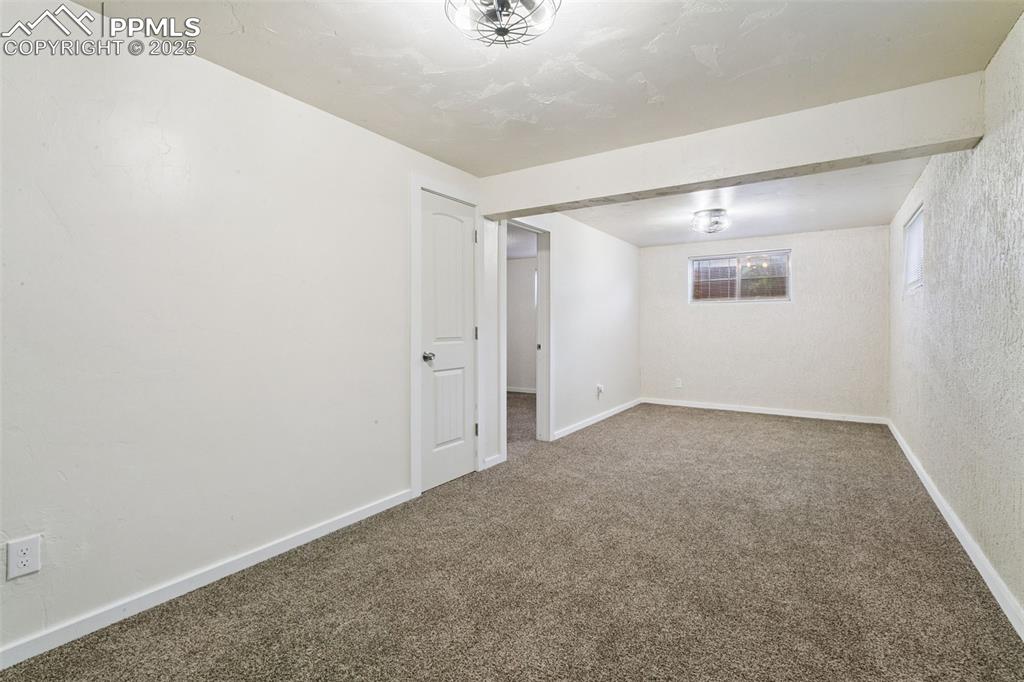 Image 32 of 43: This basement bonus room would make a great office/workout room or craft ro