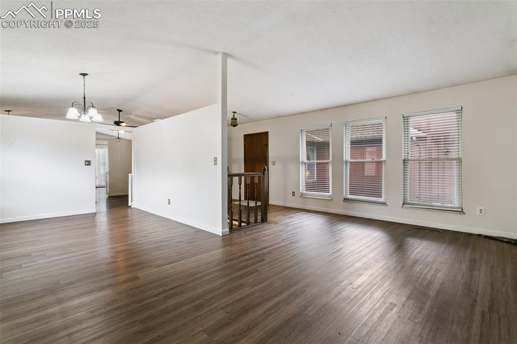 Image 4 of 43: Large formal living room is adjacent to the formal dining room.