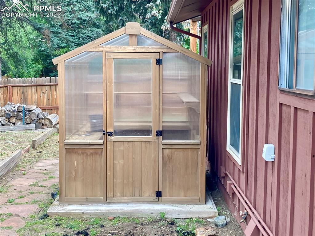 Image 41 of 43: You can grow your own vegetable and flowers in this greenhouse!