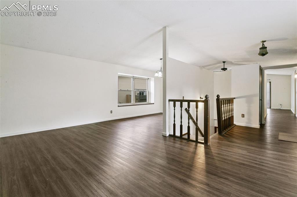 Image 6 of 43: Spacious formal living room / formal dining room features newer laminate fl