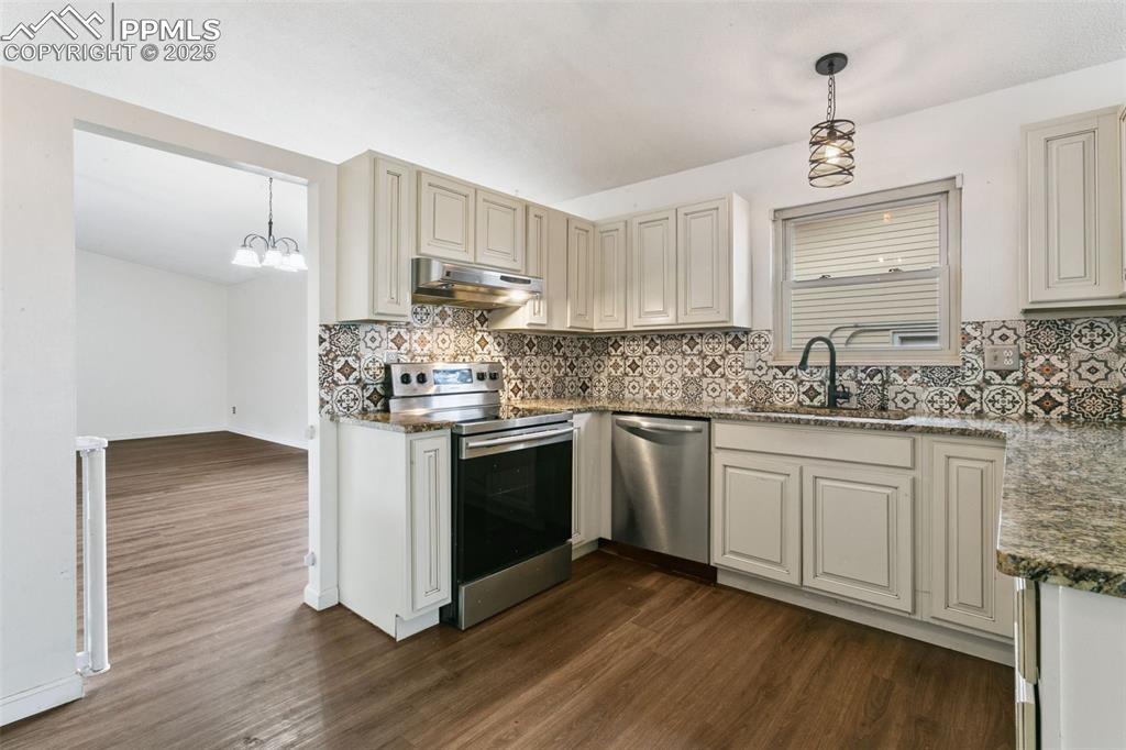 Image 8 of 43: Enjoy cooking your family meals in this wonderful kitchen featuring more th