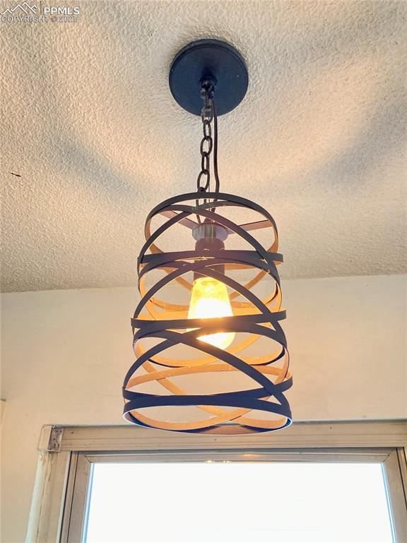 Image 9 of 43: Such a unique kitchen chandelier!