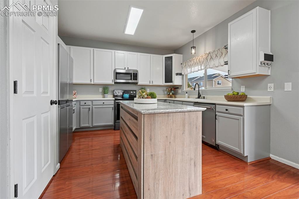 Image 12 of 49: Kitchen with large island