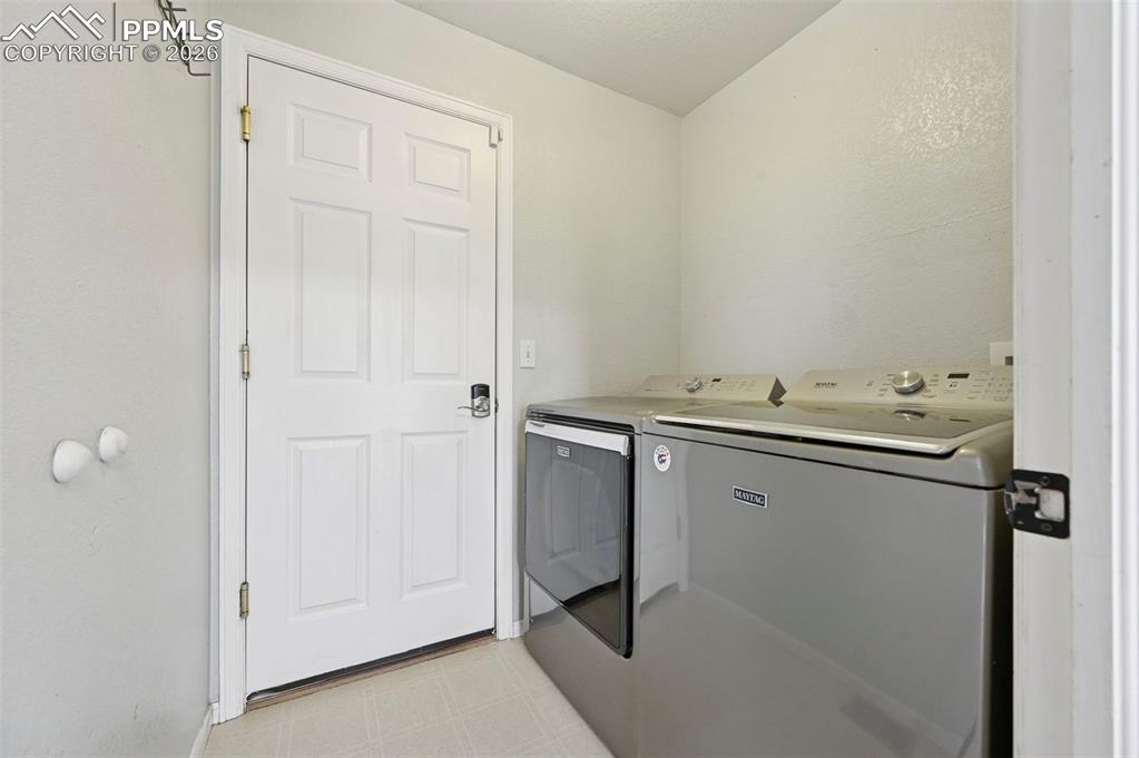Image 18 of 49: Washer and dryer, main level, off garage entrance