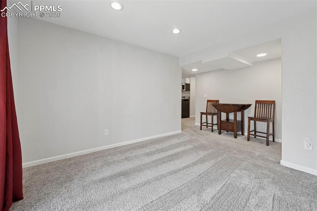 Image 39 of 49: Downstairs living/rec space with walk-out