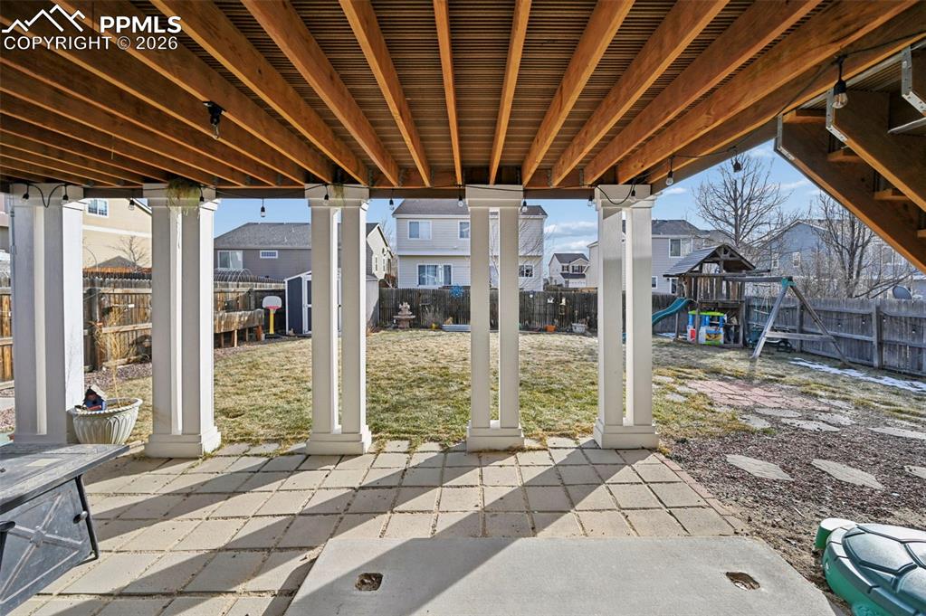 Image 40 of 49: Walk-out covered patio