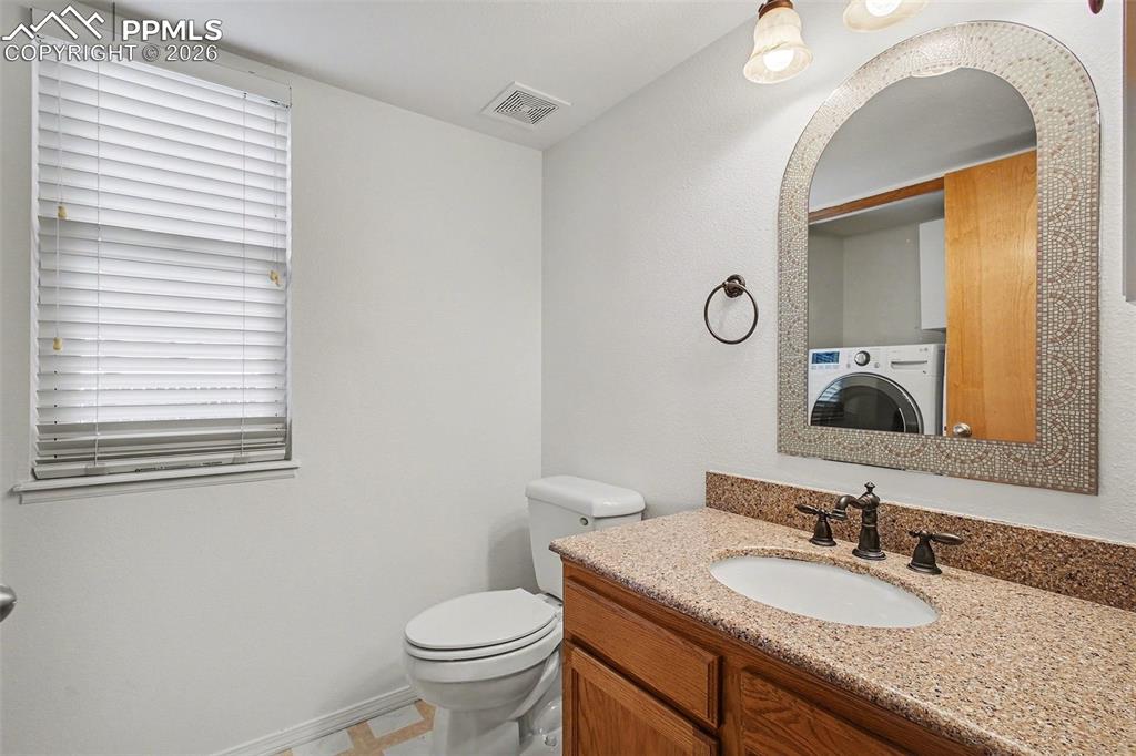 Image 12 of 28: Main floor half bathroom