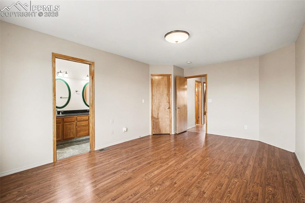 Image 13 of 28: Primary bedroom with walk in closet