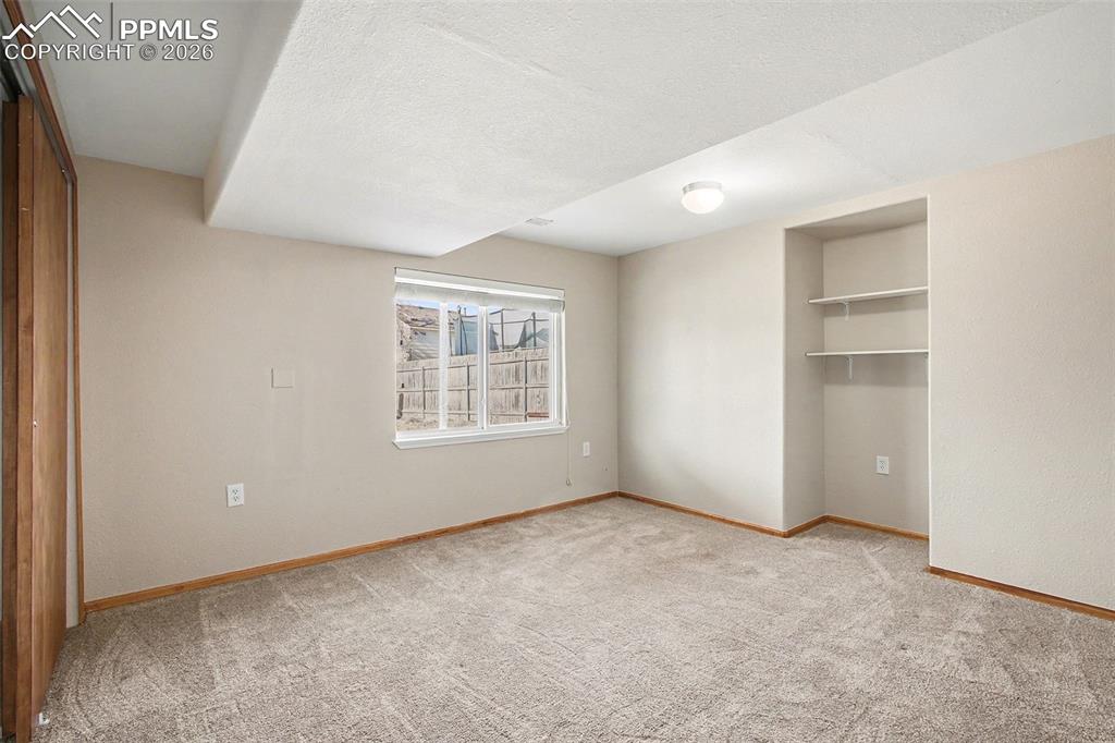 Image 22 of 28: Downstairs bedroom