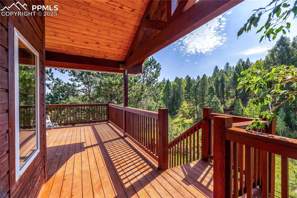 Image 30 of 47: Walkout to Covered Deck off of Primary Bedroom