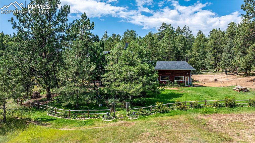 Image 43 of 47: View of yard with a view of rural / pastoral area and covered porch