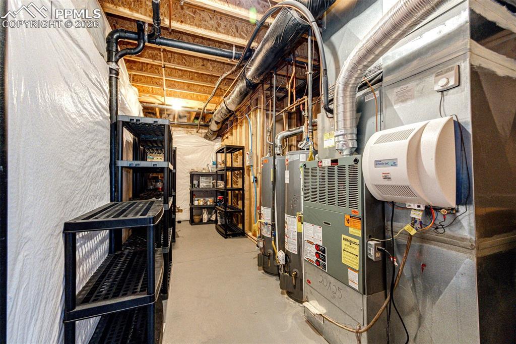 Image 41 of 49: Humidifier, 2 hot water heaters, 1 is new this past year